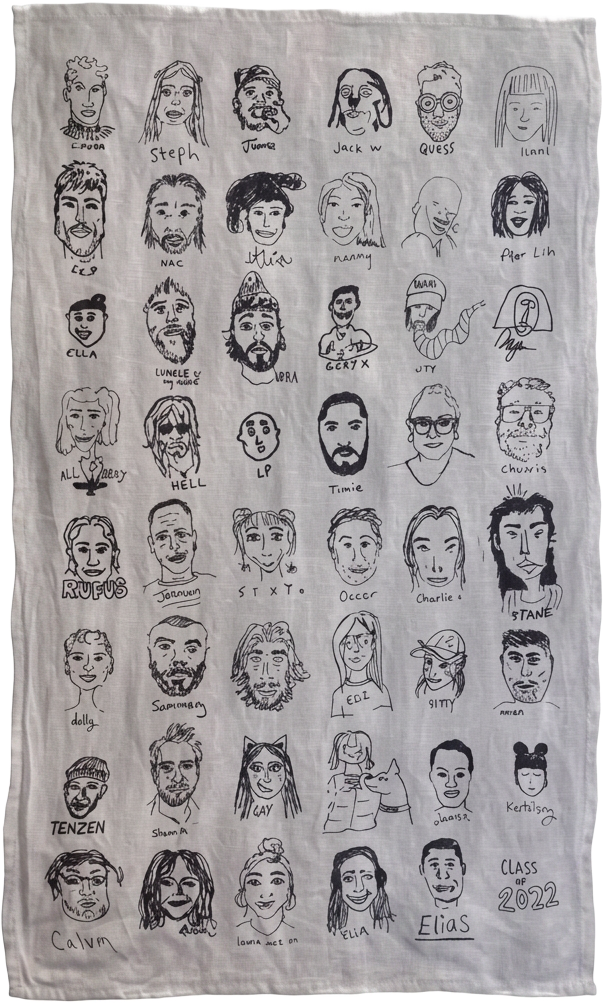 Finished tea towel covered in hand-drawn guest self-portraits